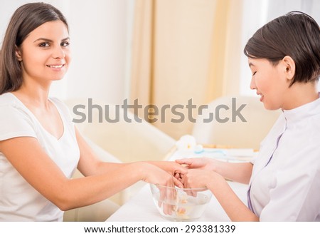 Beautiful girl in a beauty salon. Manicure or skin care. Beauty and health concept.
