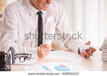 Angry businessman while working in his office.