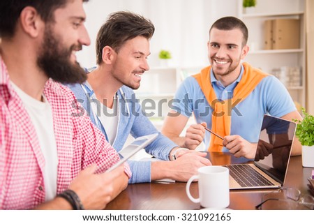 Businessmen in casual style using computers in office