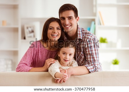 Similar – Image, Stock Photo Parents sitting with their son enjoying the time together at home