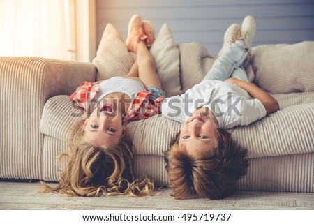 Similar – Image, Stock Photo Two beautiful sisters do their homework during quarantine. Children use gadgets for learning. Education, distance learning, home schooling during quarantine