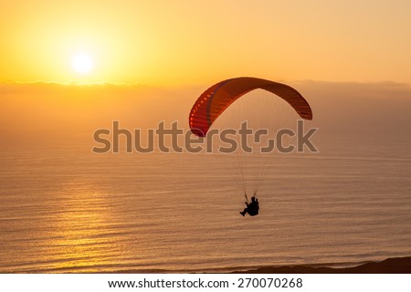 Similar – Image, Stock Photo paragliding man with orange paraglider against the sun