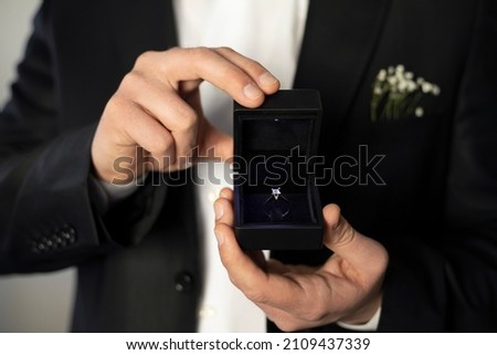 A man hand holding box with ring for marriage proposal ストックフォト © 