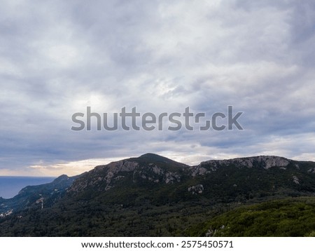 Similar – Image, Stock Photo Dark mountain range under cloudy sky in twilight