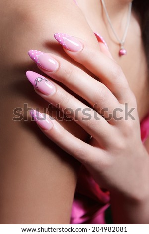 Close-up portrait of female hand with stylish elegant nail polis