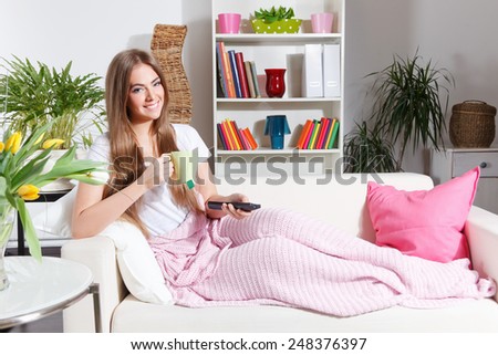 Happy woman relaxing at home