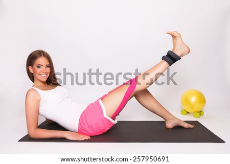 Pretty woman exercise with taped injured leg