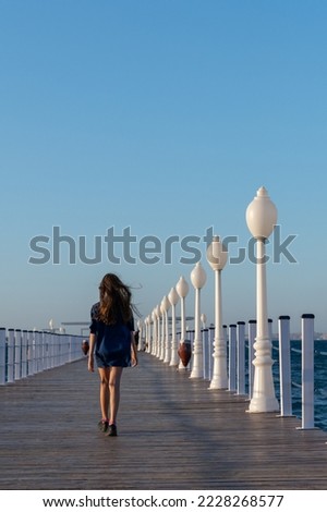 Similar – Image, Stock Photo Anonymous traveler with lantern admiring lake against mountain at night