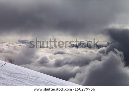 Ski slope for slalom and overcast sky. Georgia, ski resort Gudauri. Caucasus Mountains.