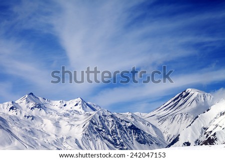 Winter snowy mountains in windy day. Caucasus Mountains, Georgia. Ski resort Gudauri.