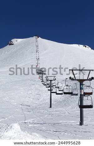 Winter mountains and ski slope at nice day. Caucasus Mountains, Georgia. Ski resort Gudauri.