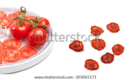 Raw tomato prepared to dehydrated and dried slices. Isolated on white background.