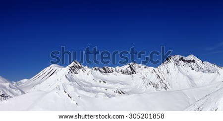 Panoramic view from ski slope in nice sun day. Caucasus Mountains, Georgia. Ski resort Gudauri.