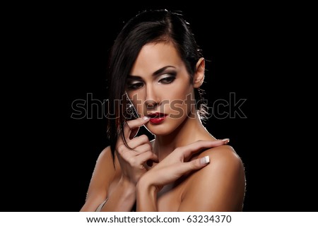 Sensual brunette lady portrait on black background