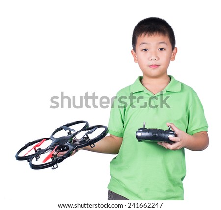 Little boy holding a radio remote control (controlling handset) for helicopter , drone or plane Isolated on white background