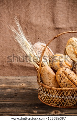 Basket with bread canvas in background