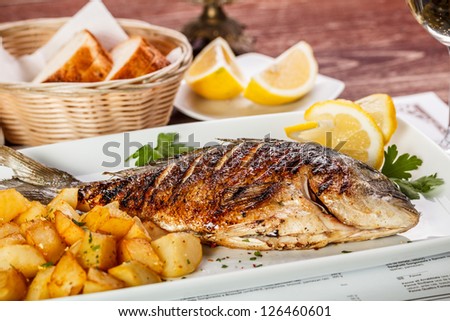 Similar – Image, Stock Photo Grilled fish and potatoes with scallion and sauce