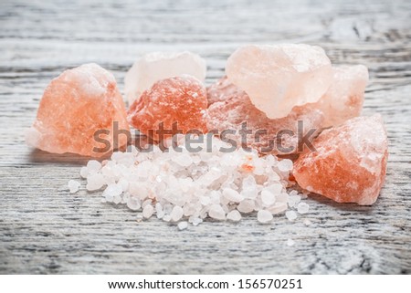 Himalayan pink crystal salt on wooden board
