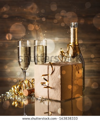 New Year concept with champagne and gift box