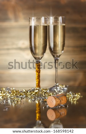 New Year concept with champagne glasses and cork