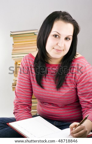 girl thinking at homework, standing the floor
