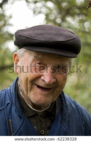 Portrait of an Old Man Smiling To Camera