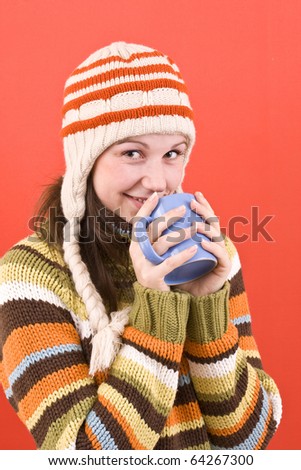 smiling woman with cup of hot-something