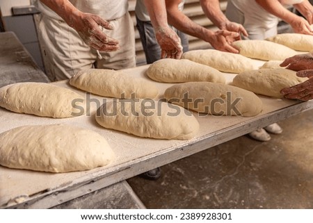 Similar – Foto Bild Bäcker formt Brot in der Küche