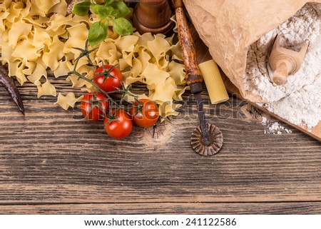 Pasta products on rustic wooden board