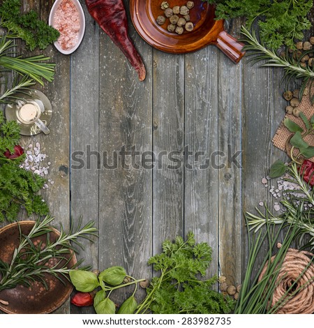 Herbs frame over wooden background