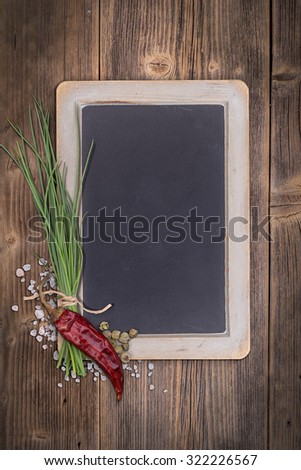 Blank chalkboard for your text on vintage wooden background