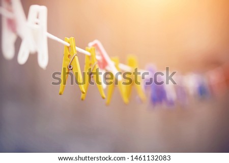 Similar – Image, Stock Photo colored plastic clothespins illuminated