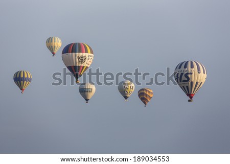 GOREME, TURKEY - APRIL 6: Hot air balloons flying over Cappadocia in Goreme, Turkey on April 6, 2014. The hot air balloon is a major tourist attraction for viewing the region's geological landscape.