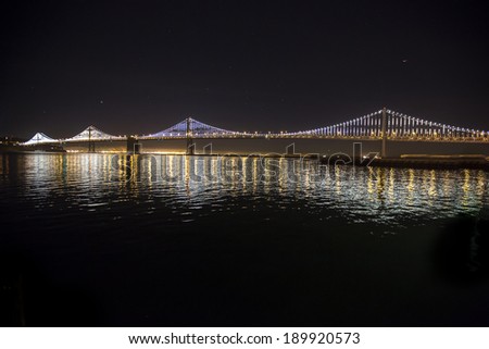 New lights illuminate the Bay Bridge connecting San Francisco and Oakland over San Francisco Bay in California.