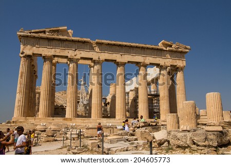Athens, Greece - July 10: Group of tourists visiting the Athens Acropolis in Athens, Greece on July 10, 2014.