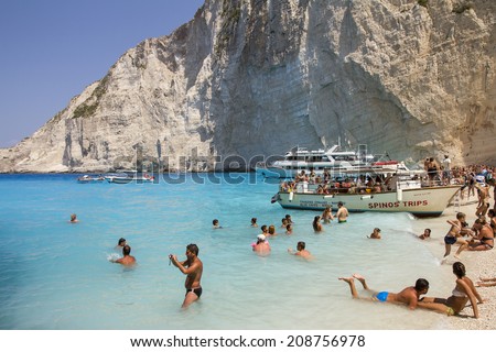 Zakynthos, Greece - June 30: Tourists at the Navagio (Shipwreck) Beach in Zakynthos, Greece on June 30, 2014. Navagio Beach is a popular attraction among tourists visiting the island of Zakynthos.