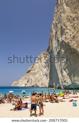 Zakynthos, Greece - June 30: Tourists at the Navagio (Shipwreck) Beach in Zakynthos, Greece on June 30, 2014. Navagio Beach is a popular attraction among tourists visiting the island of Zakynthos.