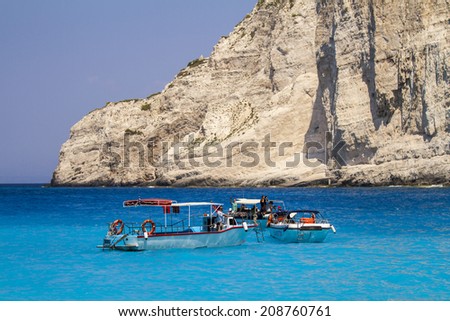 Zakynthos, Greece - June 30: Tourist boats in the Navagio (Shipwreck) Bay in Zakynthos, Greece on June 30, 2014. Navagio Bay is a popular attraction among tourists visiting the island of Zakynthos.