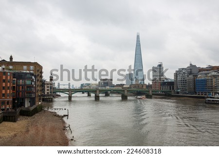London, England - October 15: View of river Thames and The Shard in London, England on October 15, 2014. The Shard is the tallest building in England.