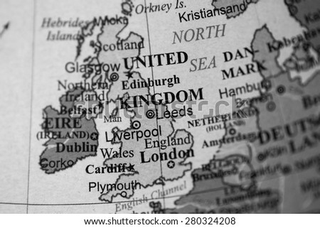 Map view of United Kingdom on a geographical globe. (black and white)