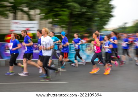 Blurred (defocused) image of marathon runners.