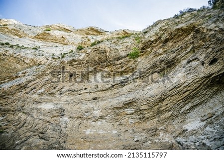 Limestone cliff above the spring of the Sorgue river in Fontaine-de-Vaucluse village in Provence, France Stok fotoğraf © 
