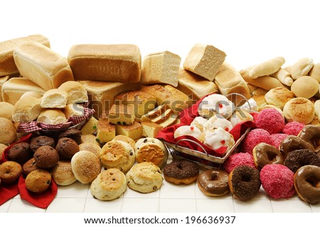 A collection of savory and sweet baked goods on an isolated white background