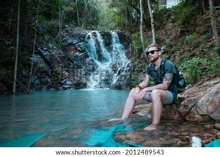 Similar – Image, Stock Photo Traveling man near waterfall in mountains