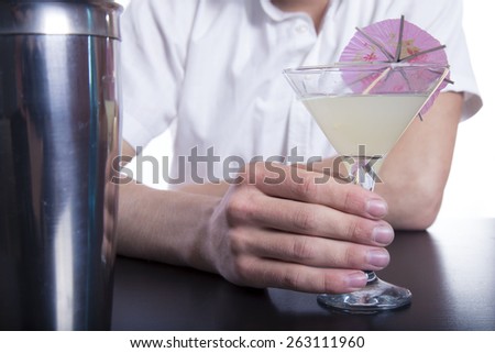 barman with cocktail over white background