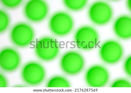 Abstract blurred background with green balls