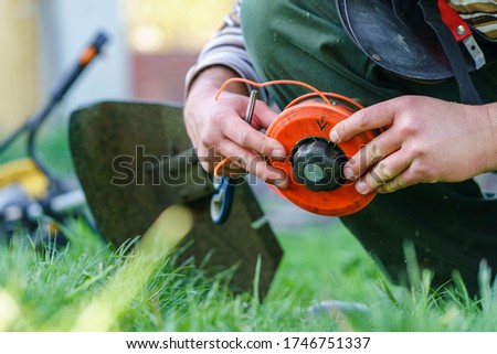 Similar – Image, Stock Photo Farmer repairing detail of agricultural machine