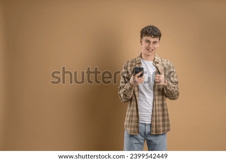Similar – Image, Stock Photo young caucasian teenage boy playing acoustic guitar on the beach. sunglasses and dark clothing.
