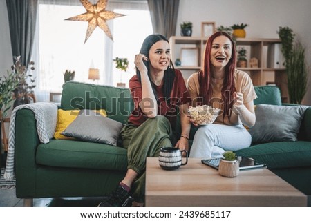 Similar – Image, Stock Photo two friends or sisters taking a picture outdoors with mobile phone over yellow background. technology and lifestyle concept