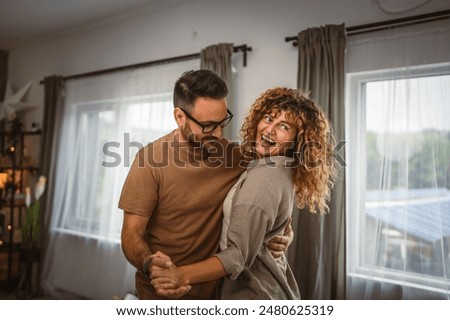 Image, Stock Photo happy couple in love at home. Afro american woman and caucasian man using laptop. ethnic love concept